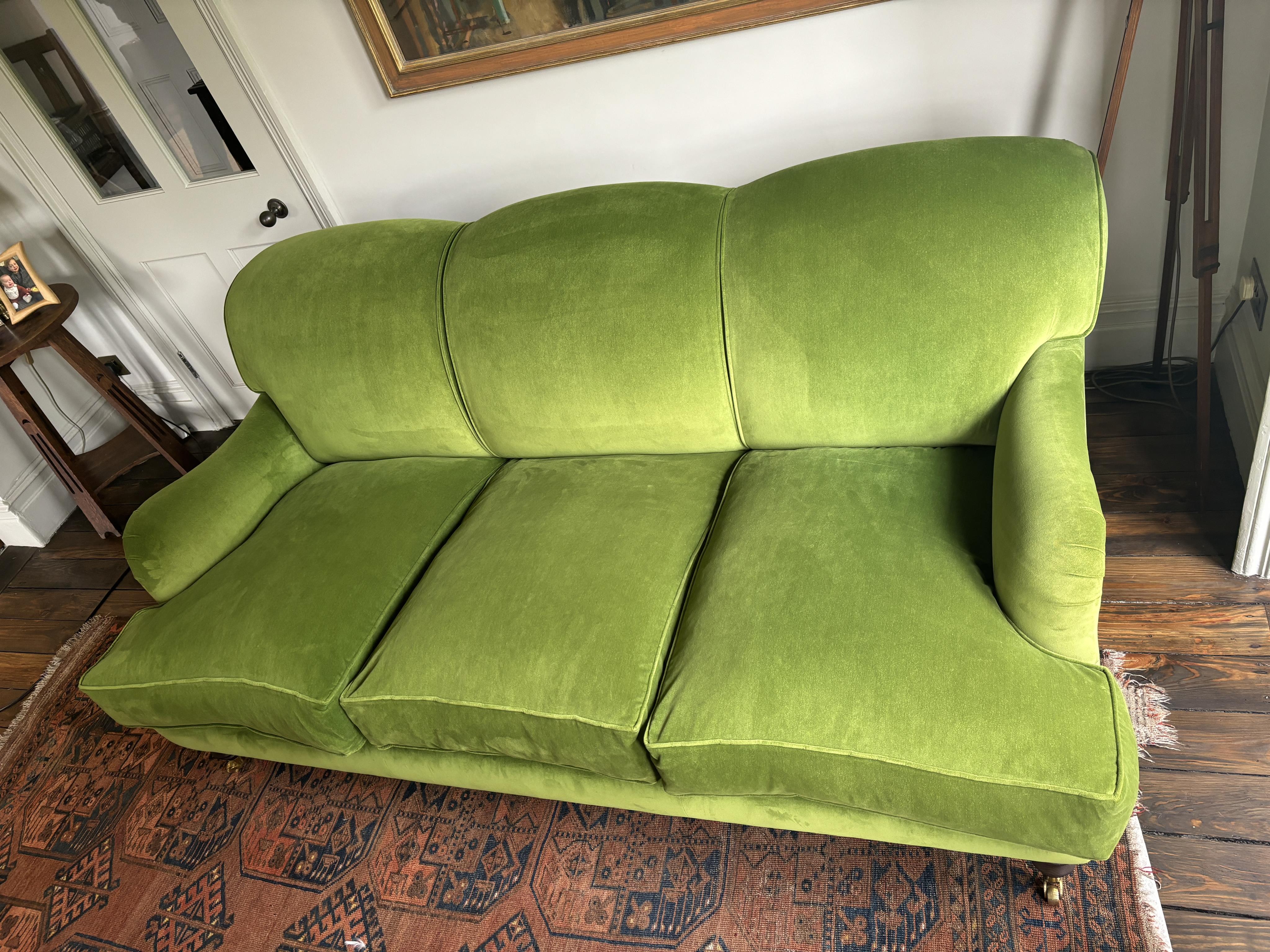 A Sofa Workshop 'Lady May' English roll arm green velvet four seater settee, Howard style sofa, seating generously feather filled, width 200cm, depth 110cm, height 84cm seat height 48cm. Condition - very good